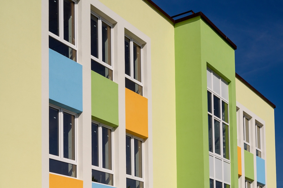 a painted building with plaster in colored paints, an element of a part of the building, close-up #POSONSKYI ANDREY W.LOKOMOTIV.IN.UA